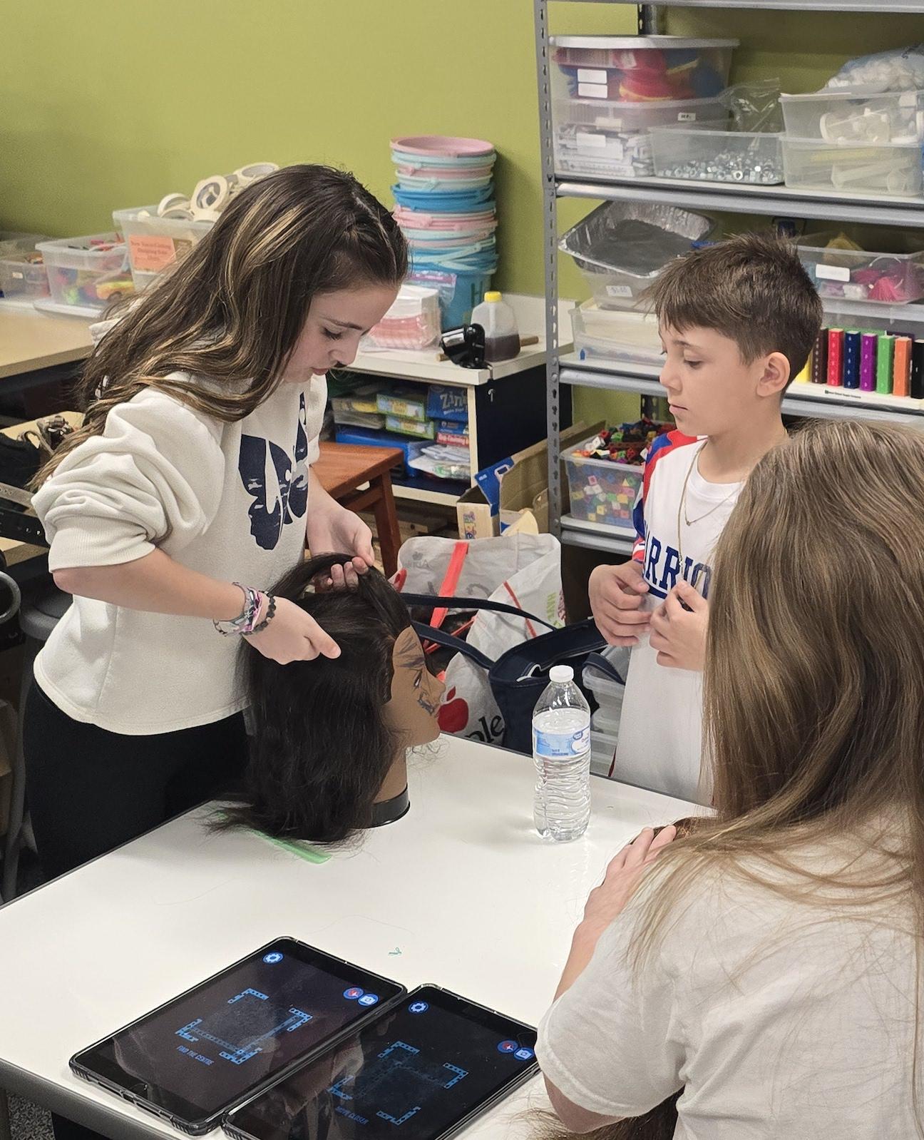 Harrison Park 5th-graders Lilliana Tommasino and Elliott Punturi engaged in hands-on learning about the CWCTC’s cosmetology program