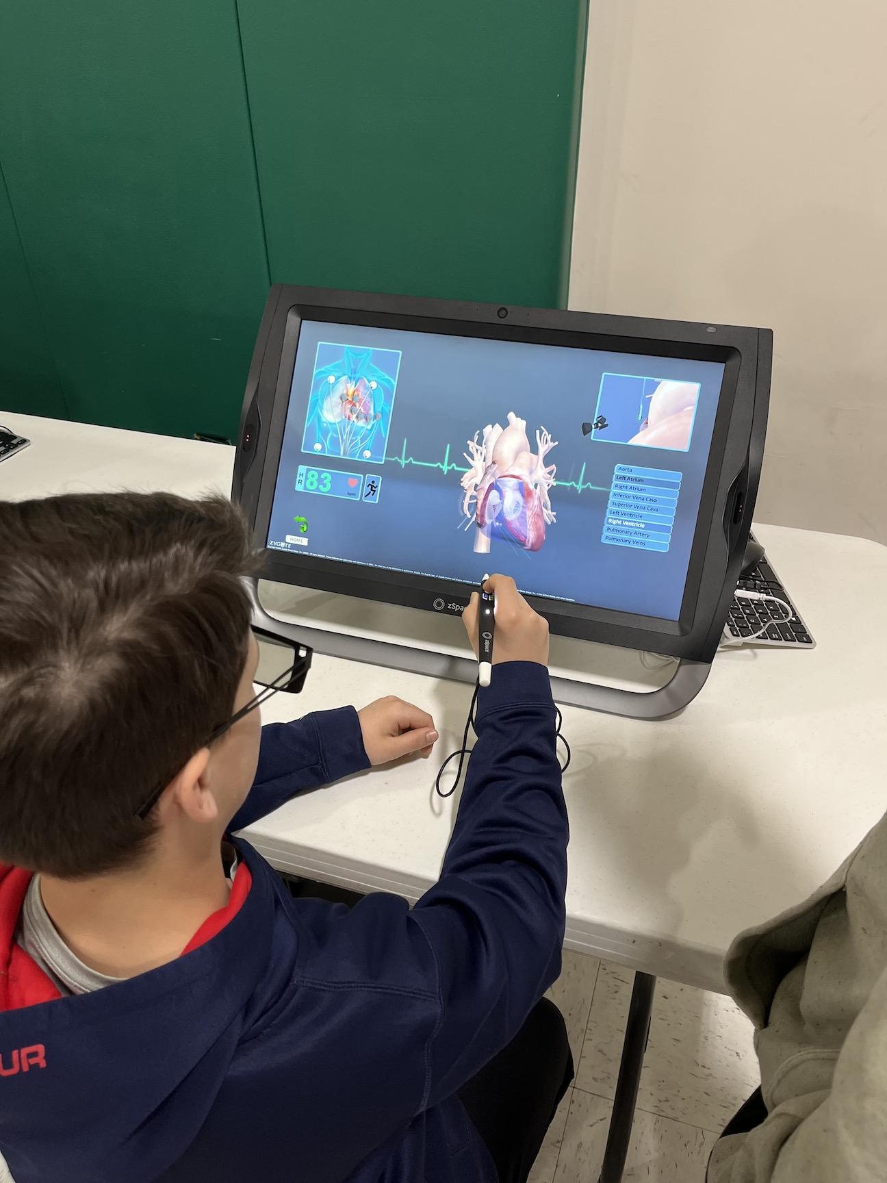 McCullough student Joshua Watson checks out the inside of the heart in 3D while using a zspace computer 